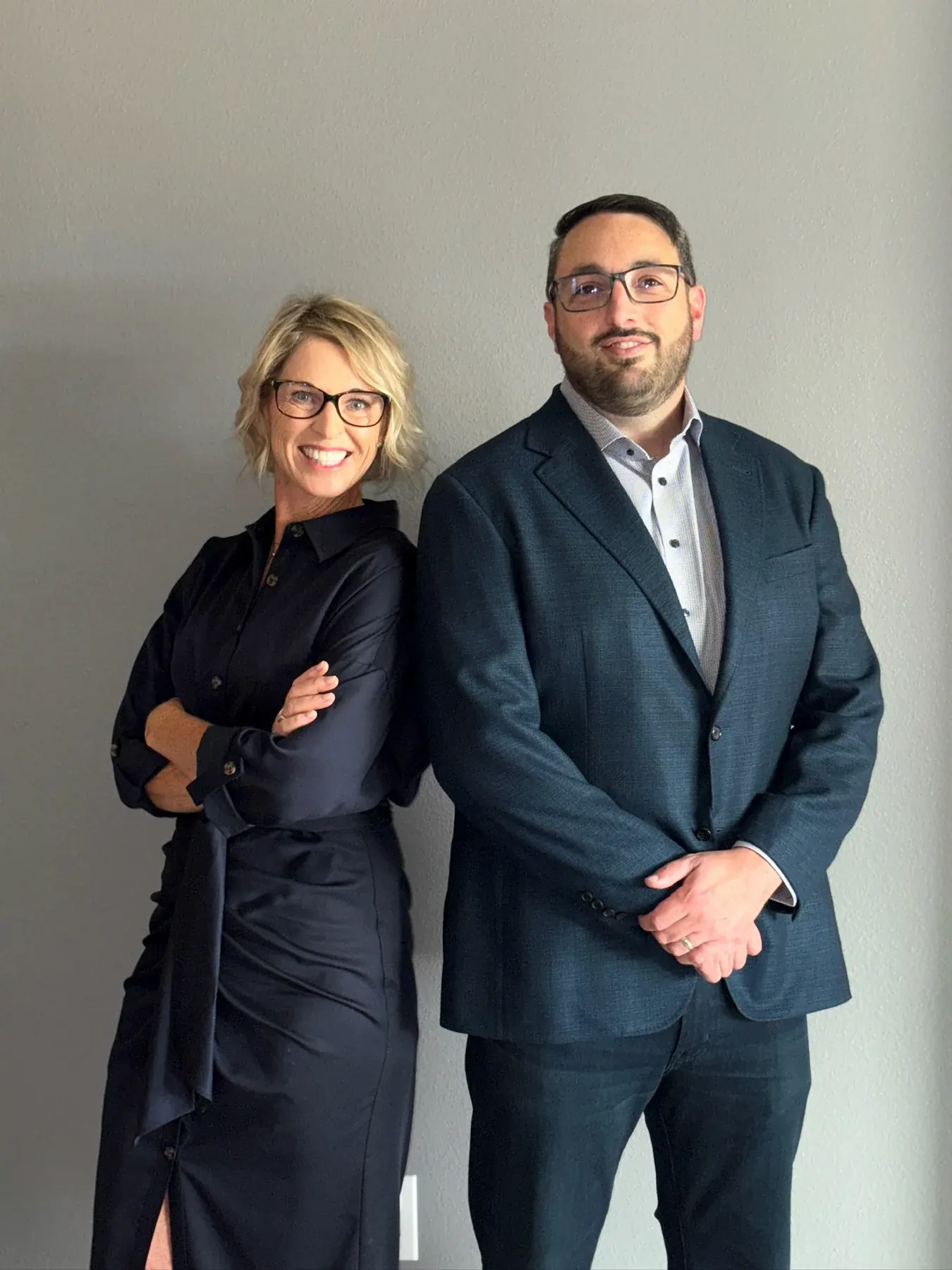 Molly Schnagl and Binu Gopinath standing together in a professional portrait